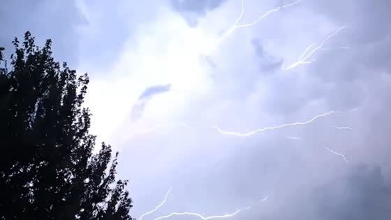 Frequent lightning flashes illuminate stormy skies over Lakeview in Chicago, USA