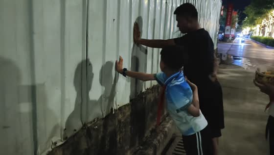 Boy plays mischievous street prank on his father in Yunnan, China