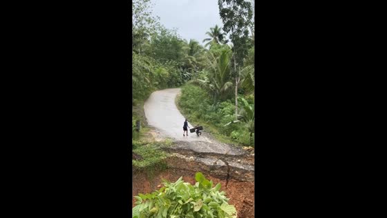 Motorist narrowly escapes as road collapses in Laak, Davao de Oro, Philippines