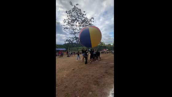 People play volleyball with giant ball in Peru