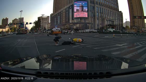 Scooter collides with car at busy intersection in Jiangsu, China