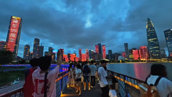 Man loses umbrella after picking it up on bridge in Guangdong, China