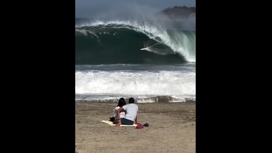 People watch surfer at Playa Zicatela, Oaxaca, Mexico
