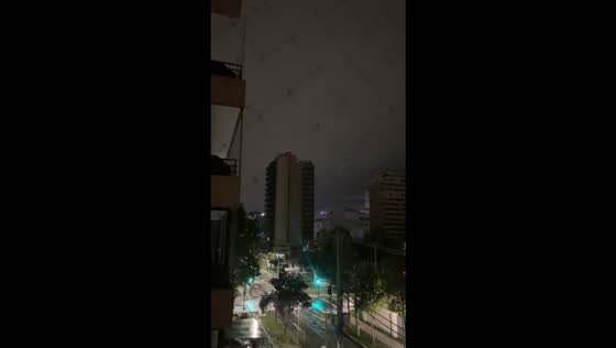 Powerful thunderstorm and lightning illuminate the sky over Las Condes, Santiago, Chile