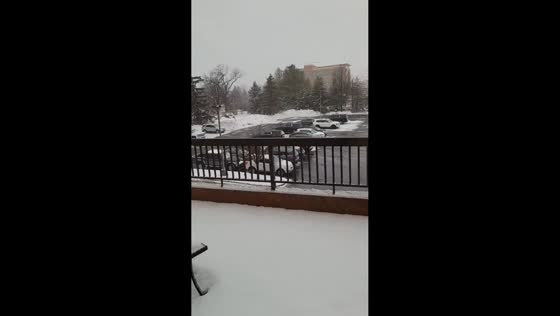 Heavy snowstorm blankets area, reducing visibility and covering roads in Michigan, USA