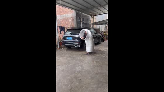 Man walks through rain inside giant pipe in Fujian, China