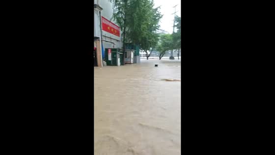 Muddy floodwaters submerge urban plaza after torrential rain in Chongqing, China