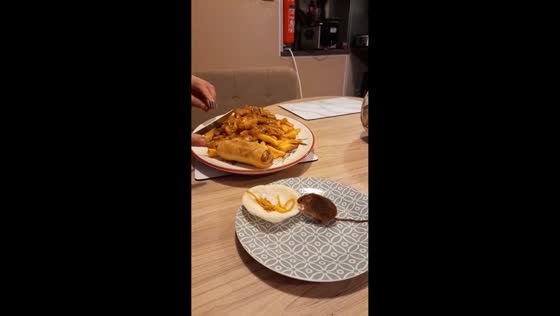  Pet mouse enjoys cracker with pasta while sitting on a plate in Norfolk, England