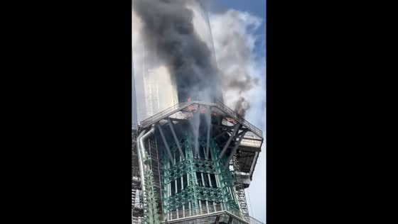 Rouen cathedral spire engulfed in flames