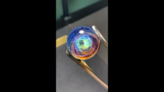Stunning galaxy glass orb revealed from high-temperature furnace in Liaoning, China