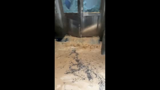 Raging floodwater bursts through doors and enters home in Wenzhou, China