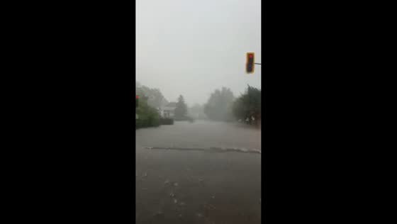 Heavy rain and hail flood streets in Pierrefonds, Quebec, Canada