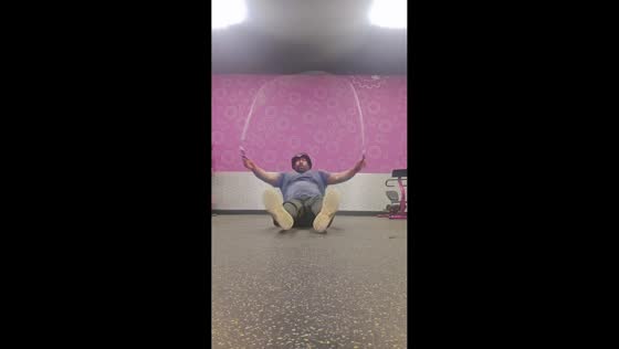 Michigan man demonstrates seated jump rope skills at local park in Saginaw, Michigan, USA