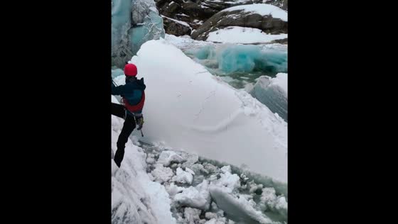 Glacier serac breaks off during ice climbing in Vallunaraju, Peru