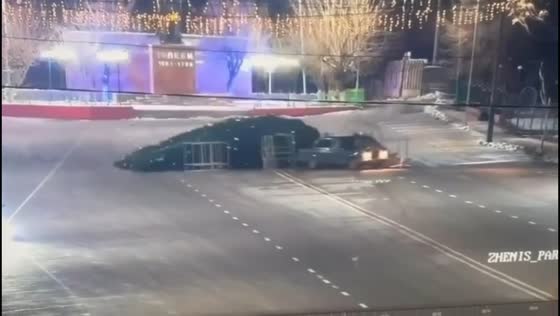 Car strikes roadside Christmas tree in Saryagash, Kazakhstan