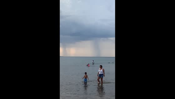 Visible waterspouts form over Lake Michigan in Chicago, Illinois, USA