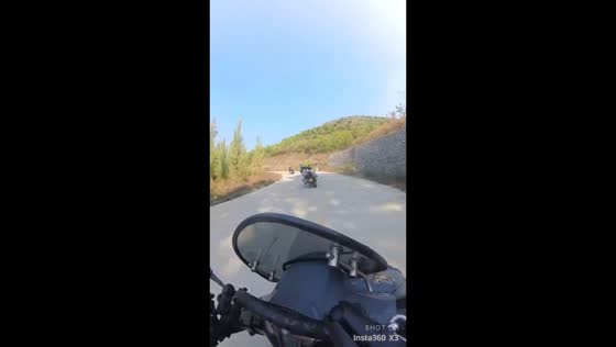 Motorcyclist falls into roadside canal after losing control on curve in Shandong, China