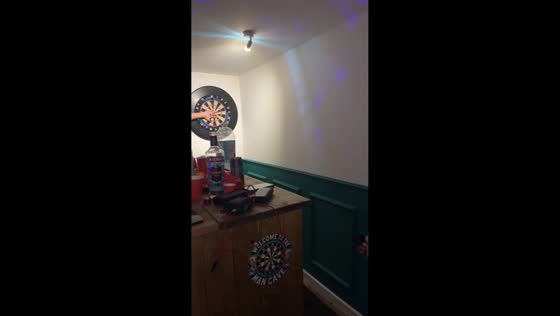 Dart hits hand during risky throw in Quedgeley, England, UK