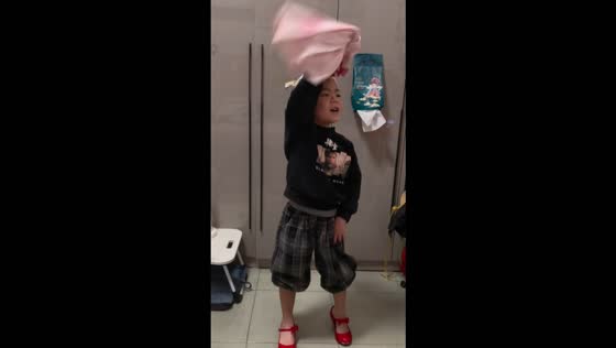 Boy hilariously struts in high heels and performs a catwalk at home in Shanxi, China