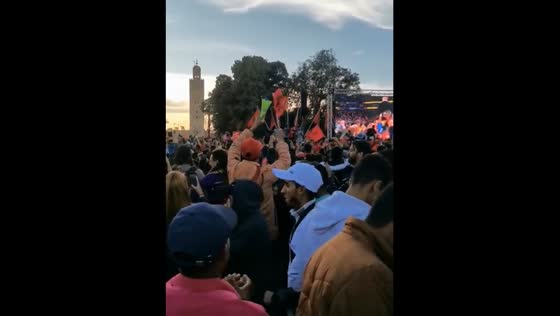 Moroccans celebrate their team's victory for reaching the semi-finals at the 2022 World Cup