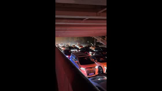 Motorists take shelter under bridge during hailstorm in Beijing, China