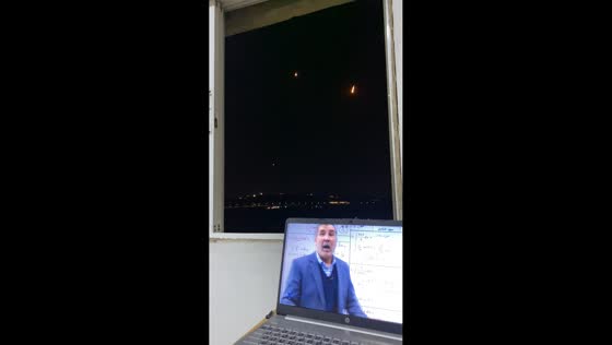 Missiles seen in skyline during online lesson in Amman, Jordan