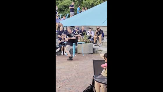 Bagpiper performs for cheering crowd in Boston, USA