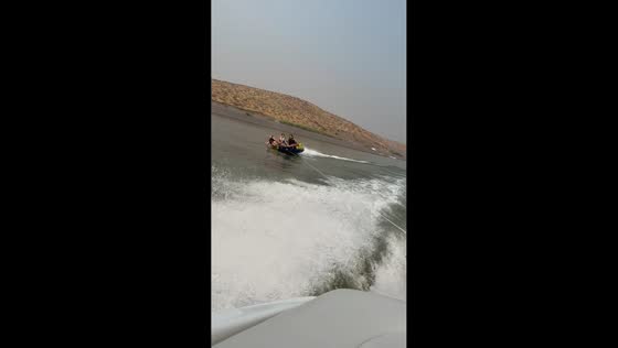 Kids tumble off inflatable tube during fun boat ride in Othello, Washington, USA