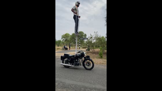 Motorbike stunt: climbing the ladder of daredevilry!