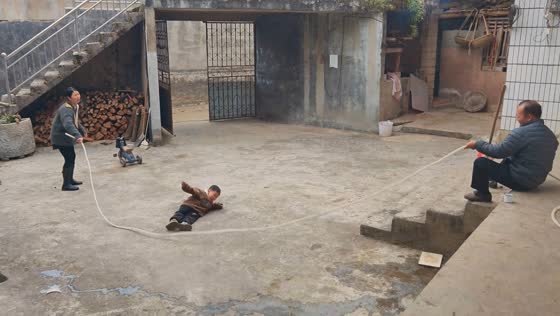 Little boy trips while jumping rope in Guizhou, China