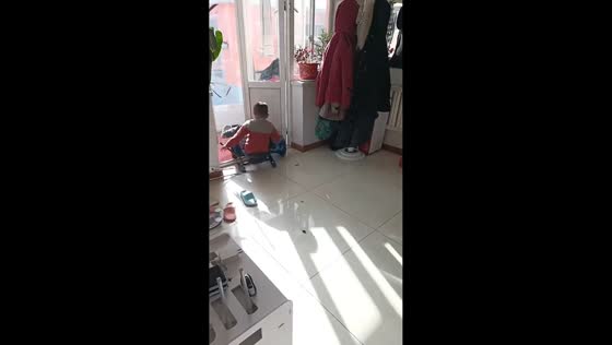 Boy crashes hoverkart into door indoors in Liaoning, China
