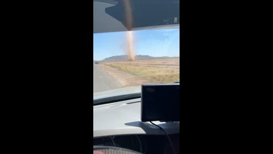 Dust devil spotted near road in Arizona, USA