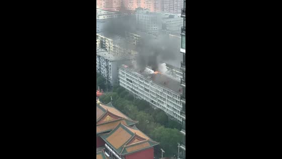 Fire sends thick smoke and flames from residential building in Shenyang, China
