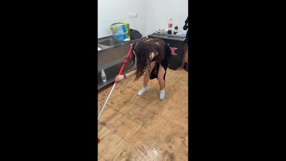 Woman slips while mopping in Málaga, Spain