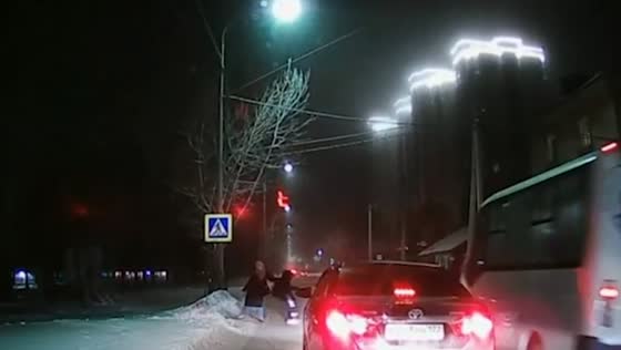 The girl saved the schoolboy, who nearly fell under the wheels of the bus