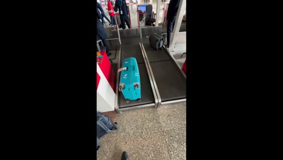 Traveler tests weighing machines at Chandigarh Airport in Punjab, India