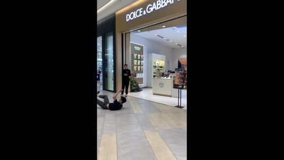 Man falls attempting tumbling trick in front of store staff in Hanoi, Vietnam