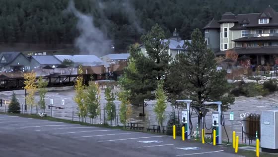 Rising San Juan River floodwaters overwhelm downtown Pagosa Springs in Colorado, USA
