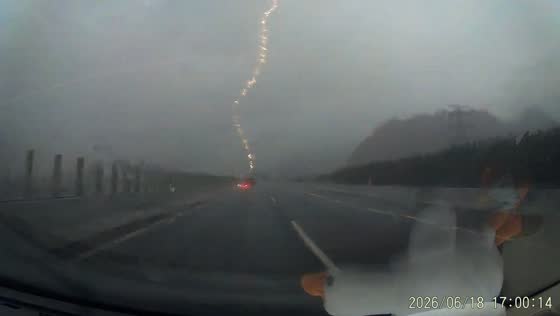 Lightning strikes near car on Zhuhai highway during storm in Guangdong, China