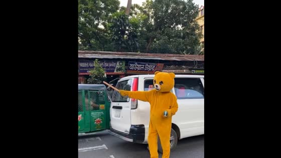 Teddy bear costume controls traffic in Bangladesh after government overthrown