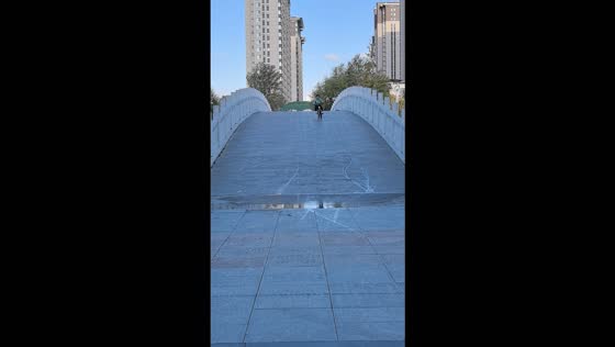 Girl loses control of her bike and falls after riding through a puddle in Shaanxi, China