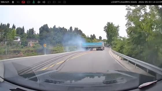 Trailer truck drifts through rural curve in Sichuan, China