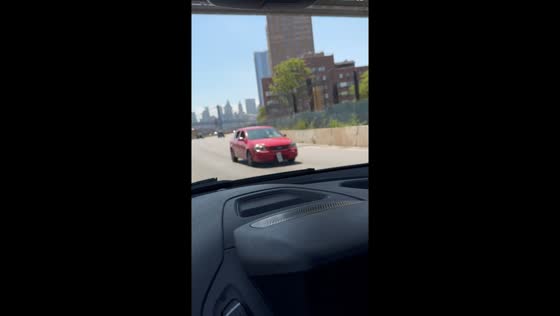 Car drives in reverse on highway in Manhattan, New York, USA
