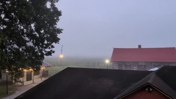Dense morning fog blankets rural property in Metamora, USA