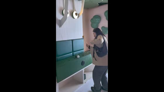 Woman startled and breaks mallet while playing arcade game in Guizhou, China