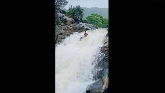 Adventurous ride: man takes on the playful waters of Mulshi Waterfall, Maharashtra