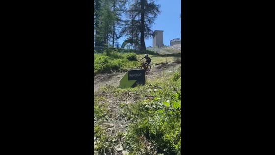 Mountain biker crashes after landing on trail curve in La Thuile, Italy