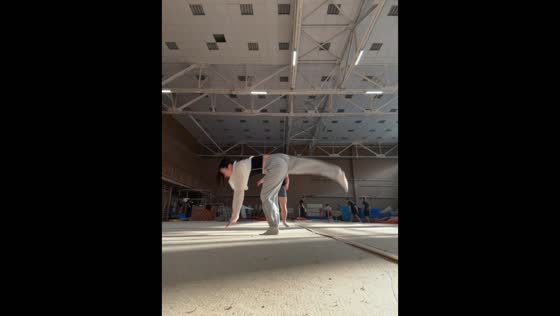 Woman loses her balance and falls during flip practice at a gym in Moscow, Russia