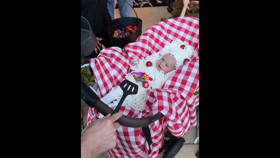 Baby spaghetti costume on Halloween in Tulsa, Oklahoma, USA