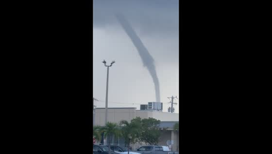 Large waterspout spins ashore near Key West, USA